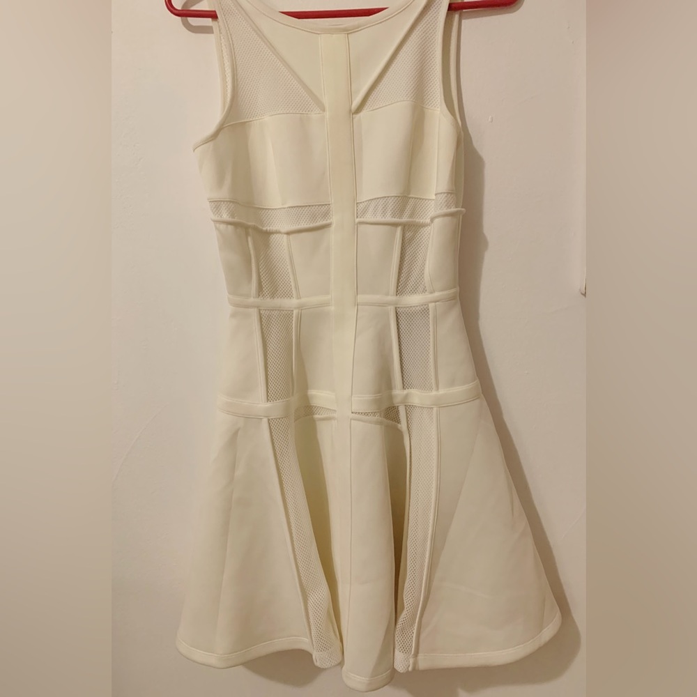 Stella & Jamie white dress with mesh panels size small. New with tags!